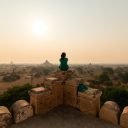 lone-person-sits-on-top-of-a-temple-overlooking-old-bagan-myanmar.jpg